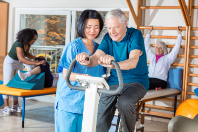 nurse helping elder man